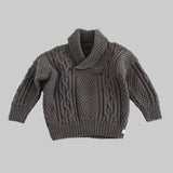 Mushroom knitted sweater with cable pattern on a light gray background