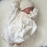 Baby asleep on short wool sleep sheepskin baby rug