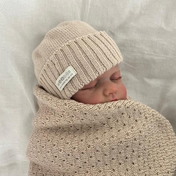 baby in sand newborn beanie