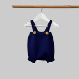 Baby romper in navy on hanger