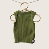 Moss ribbed baby singlet hanging on a wooden hanger against a plain background