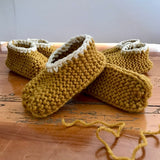 Baby slippers in mustard