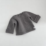 Mushroom knitted baby slouchy sweater on a white background