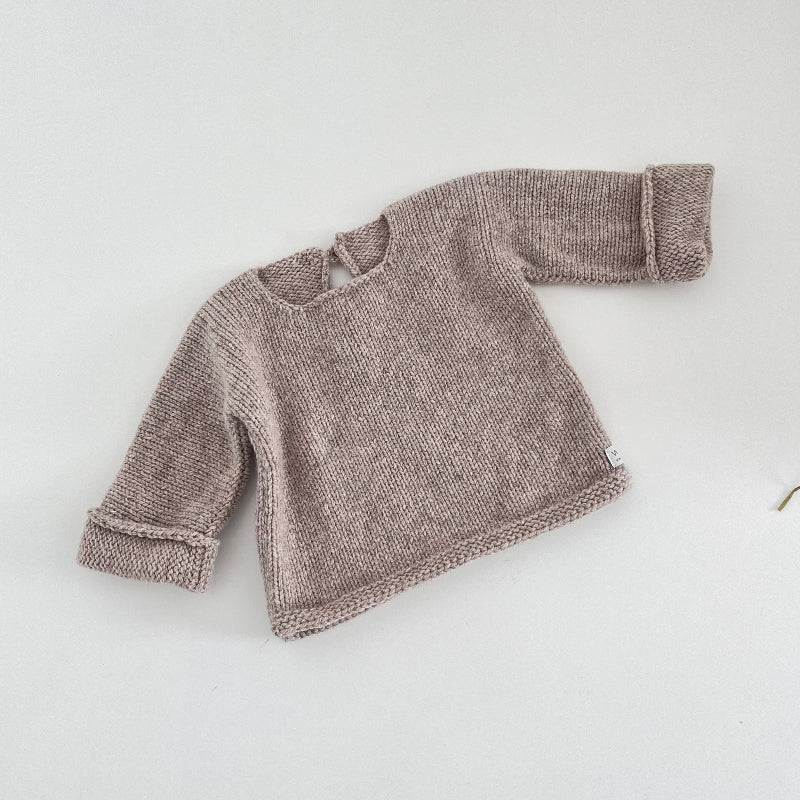 Oatmeal knitted baby slouchy sweater on a white background