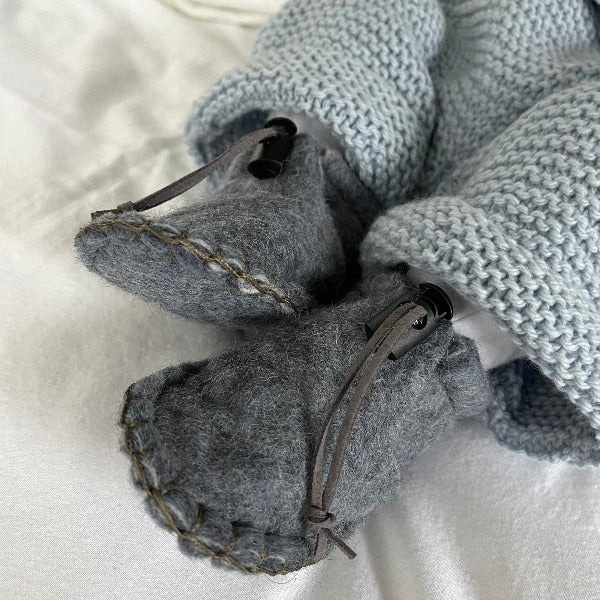 Baby wearing blue felted Pixie Boots