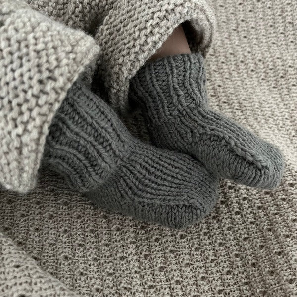 Baby wearing mushroom merino double knit socks