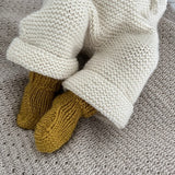 Baby wearing mustard double knit socks