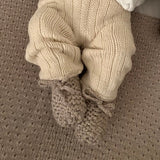 baby wearing oatmeal premature chunky booties