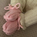 Baby wearing pink baby loafers