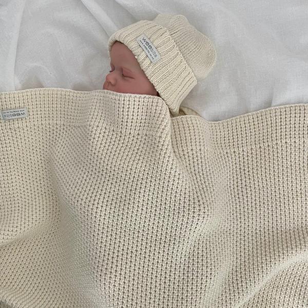 baby with natural merino buggy blanket