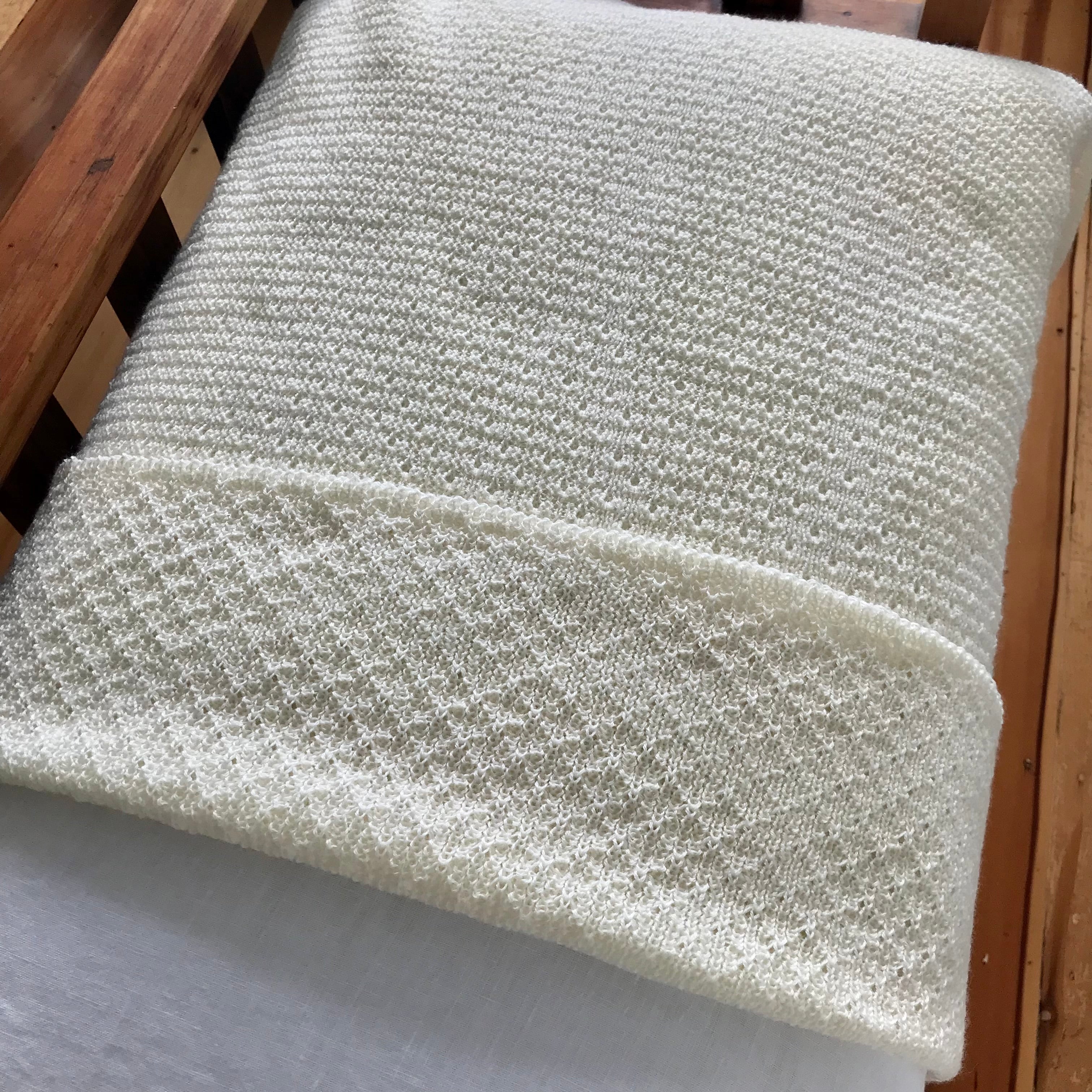 Cream-baby-wrap-on bed