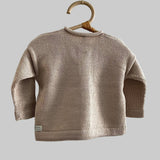 Back view of sand baby marley cardigan on hanger