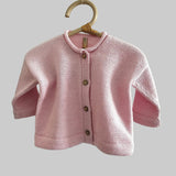 Blossom pink baby marley cardigan on wooden hanger