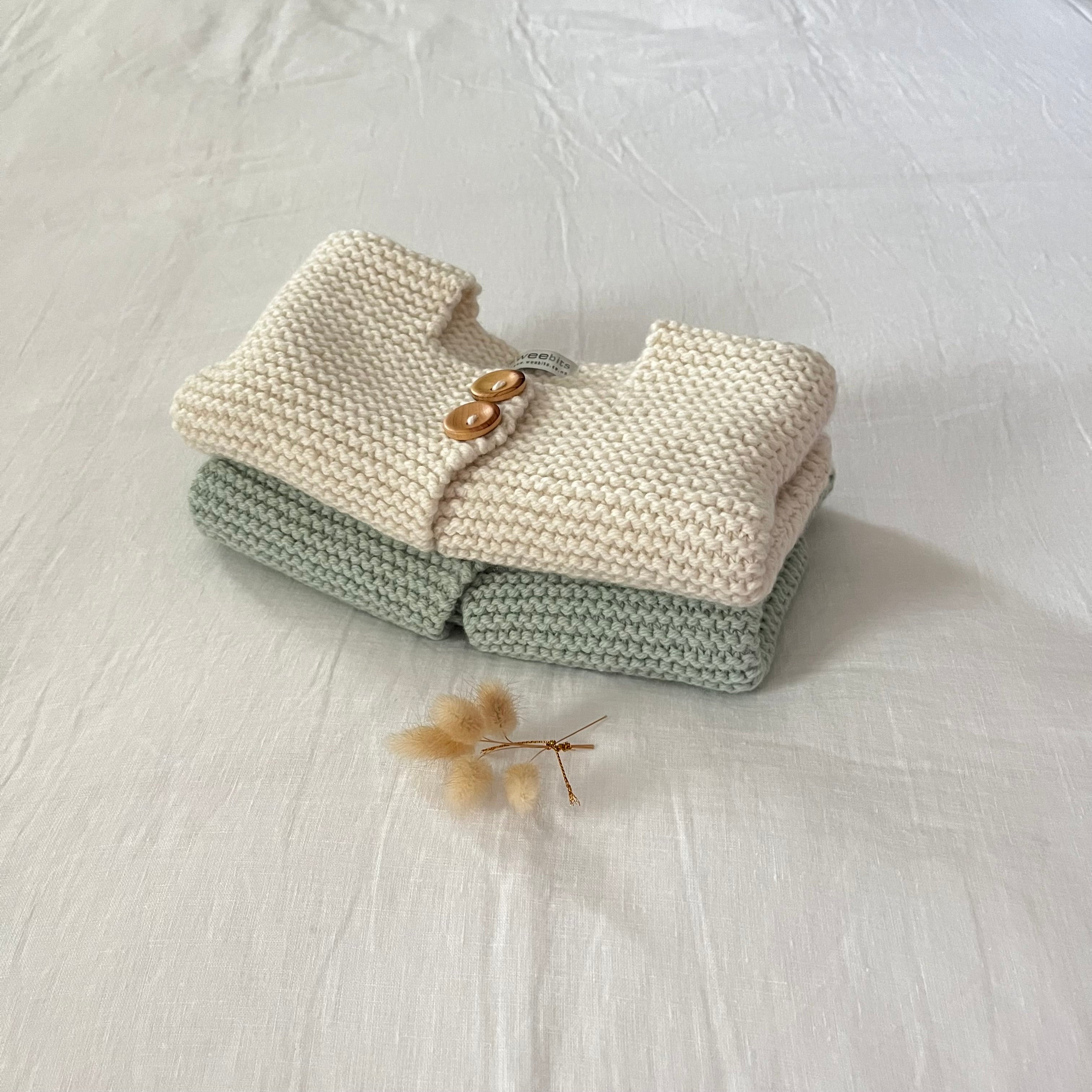 Knitted jackets in two colors on a white background