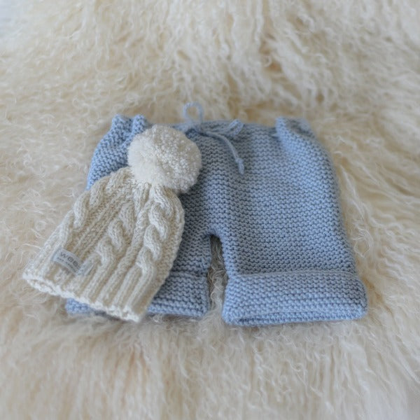 Chunky knit pants in blue with cable knit hat
