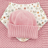 close up of blossom pink pram blanket newborn beanie dribble bib