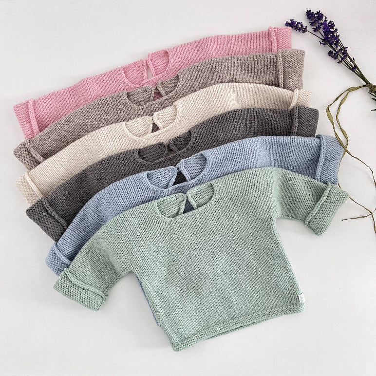 flat lay of baby slouchy sweaters