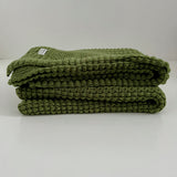 folded moss merino cot blanket nz made