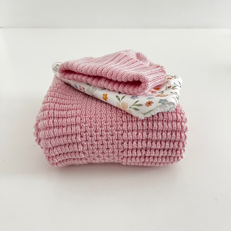 Folded Pram blanket, newborn beanie and dribble bib in blossom pink