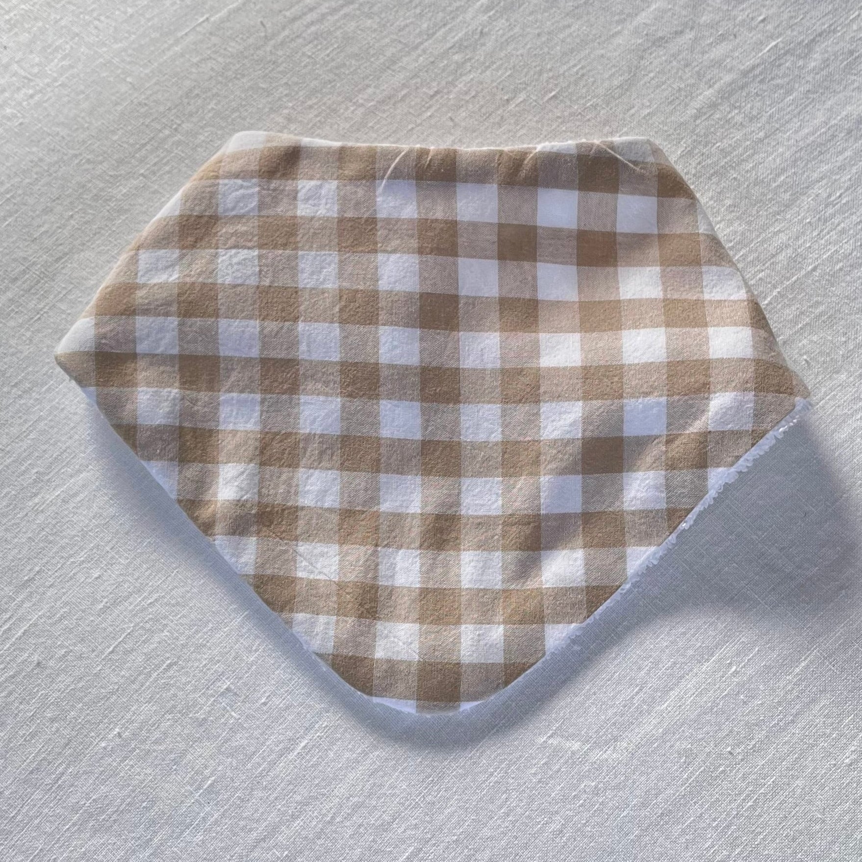 Gingham dribble bib tan and white squares