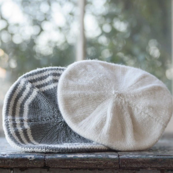 Natural and mushroom natural stripe baby beret on window ledge