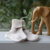 Oatmeal baby socks on shelf