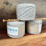 Oatmeal marle merino yarn 100g balls on shelf