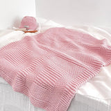 Pattern detail of blossom pink pram blanket with newborn beanie