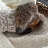 Underside of light brown possum booties