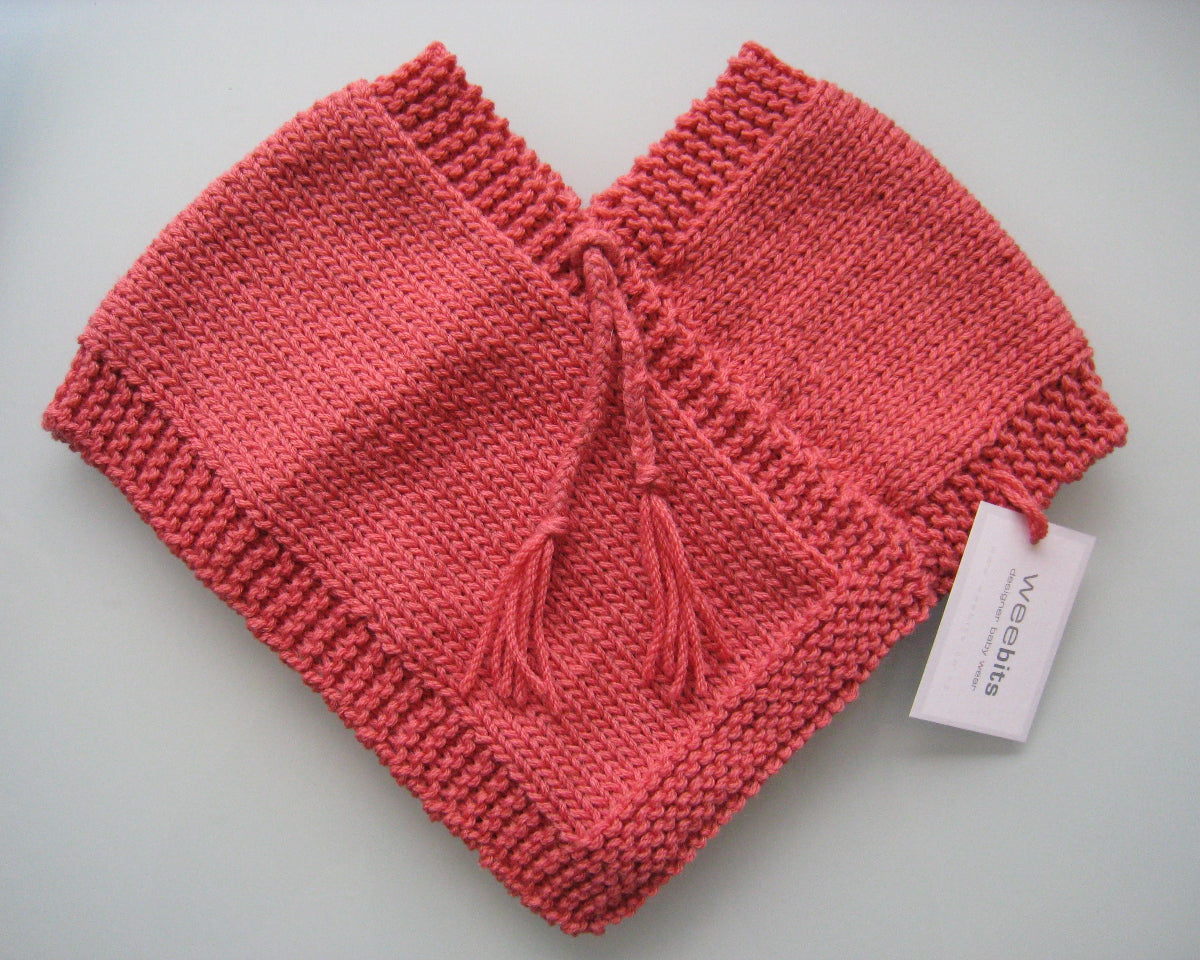 Weebits first poncho in raspberry