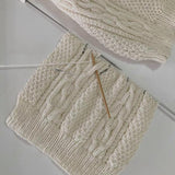 Baby Aran jumper being knitted