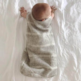 Baby in light grey baby sleeping bags
