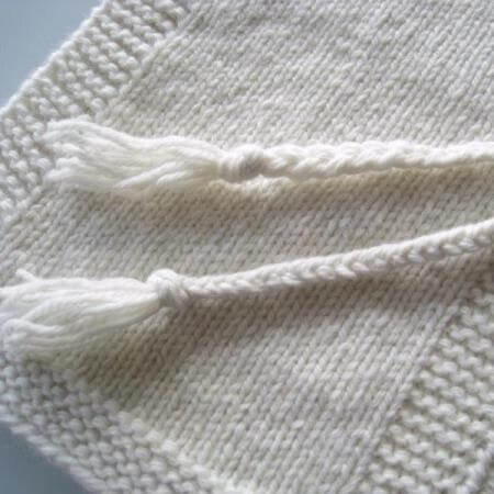 Baby poncho with tassel