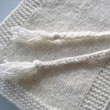 Baby poncho with tassel