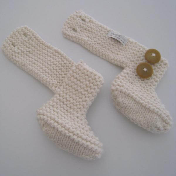 Button detail of chunky knit boots