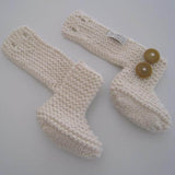 Button detail of chunky knit boots