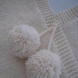 Childrens poncho with pompom