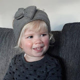 girl wearing mushroom baby headband