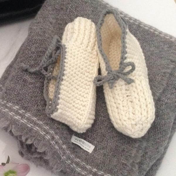 Mum slippers on cot blanket
