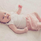 Newborn in pink over nappy pants