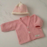 Pink baby cardigan and beanie set