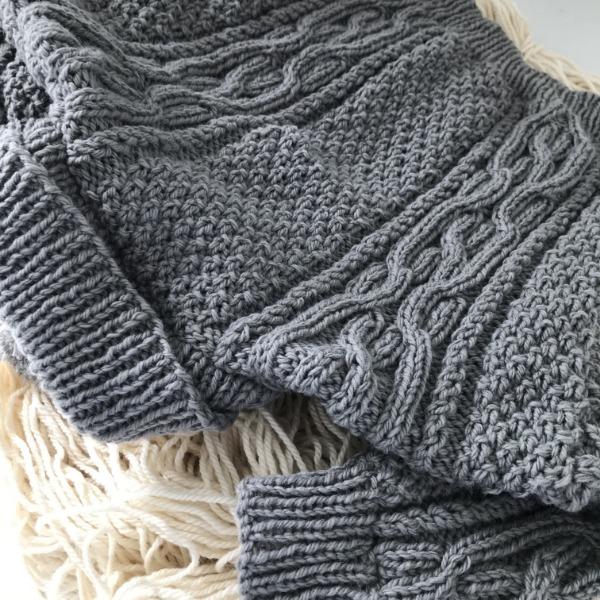Shoulder detail of mushroom baby Aran sweater
