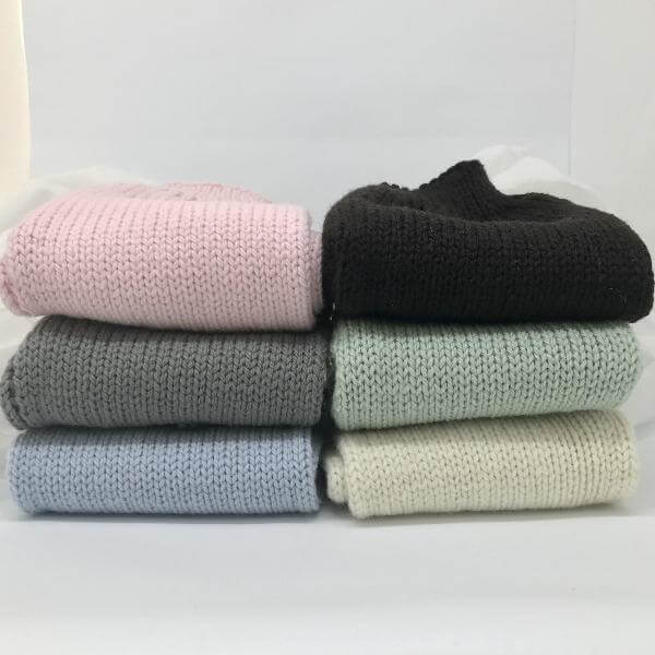 stack of knitted baby pants