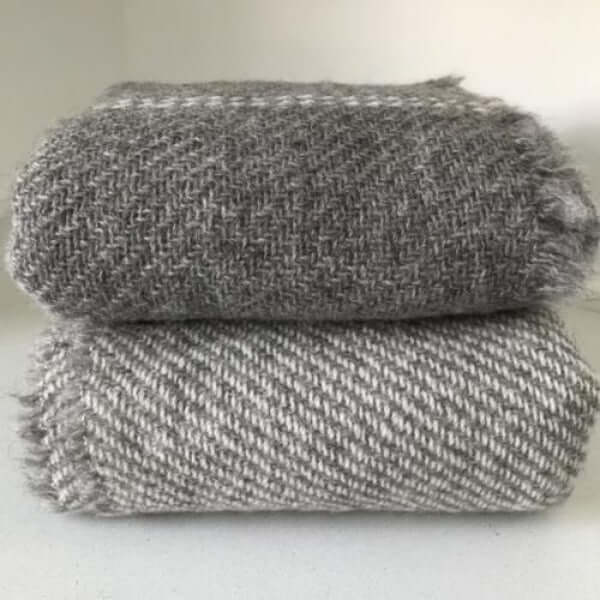 Stack of stansborough-cot blankets