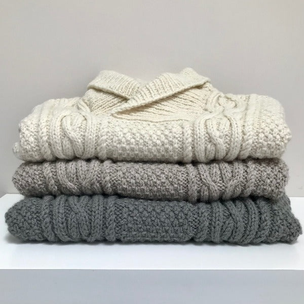 Stack of the baby Aran jumper