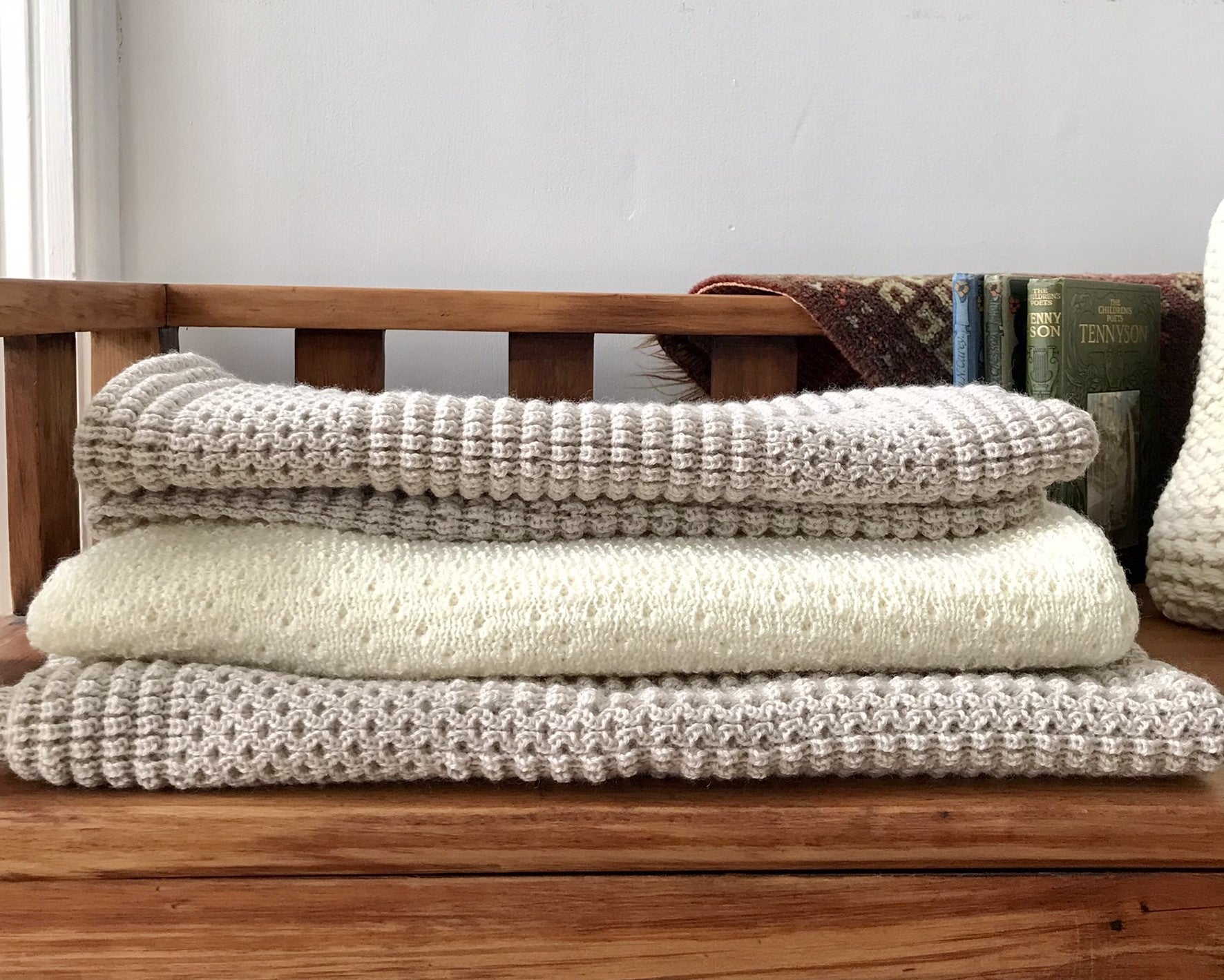 Stack of merino baby blankets and rugs