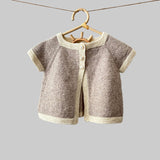 Chloe cardigan in Oatmeal with natural trim on hanger