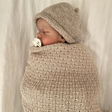 Baby asleep in oatmeal merino wool wrap
