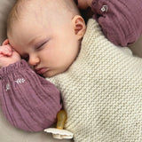 Baby asleep wearing merino tank top