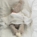 Baby asleep wearing oatmeal premature pants